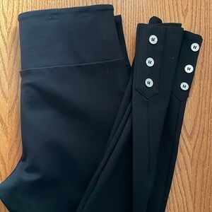Romeo + Juliet black leggings with 3 button ankle embellishment.